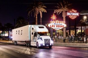 White semi truck with PRS logo on the side driving down Las Vegas Blvd. Courtesy of Phililip’s Roadway Service trucking company.